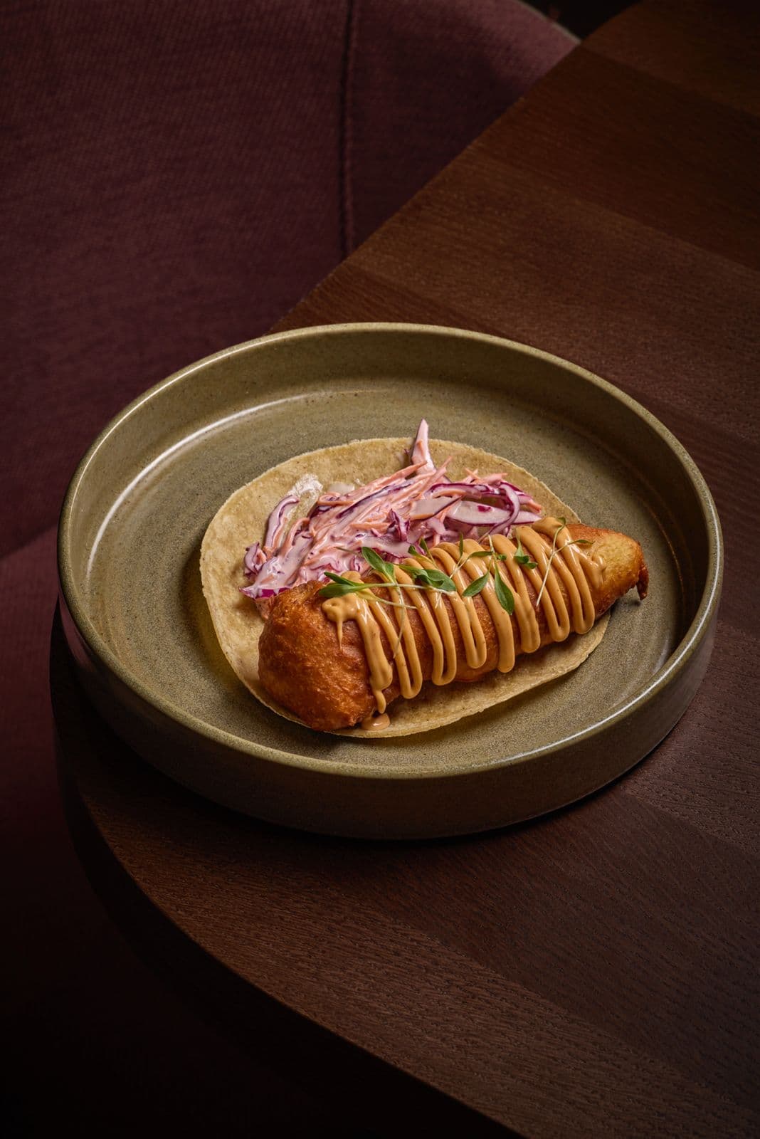 Baja Taco with battered hake, red cabbage and house salsa